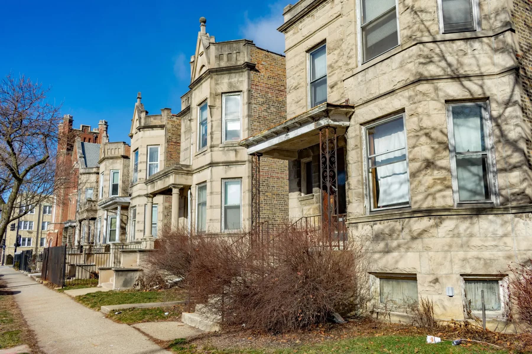 Row of greystone homes on a Chicago street