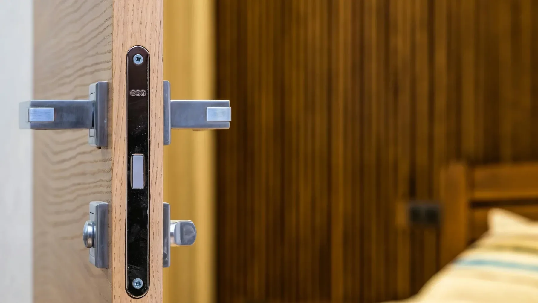 Door lock and handle on an open wooden door