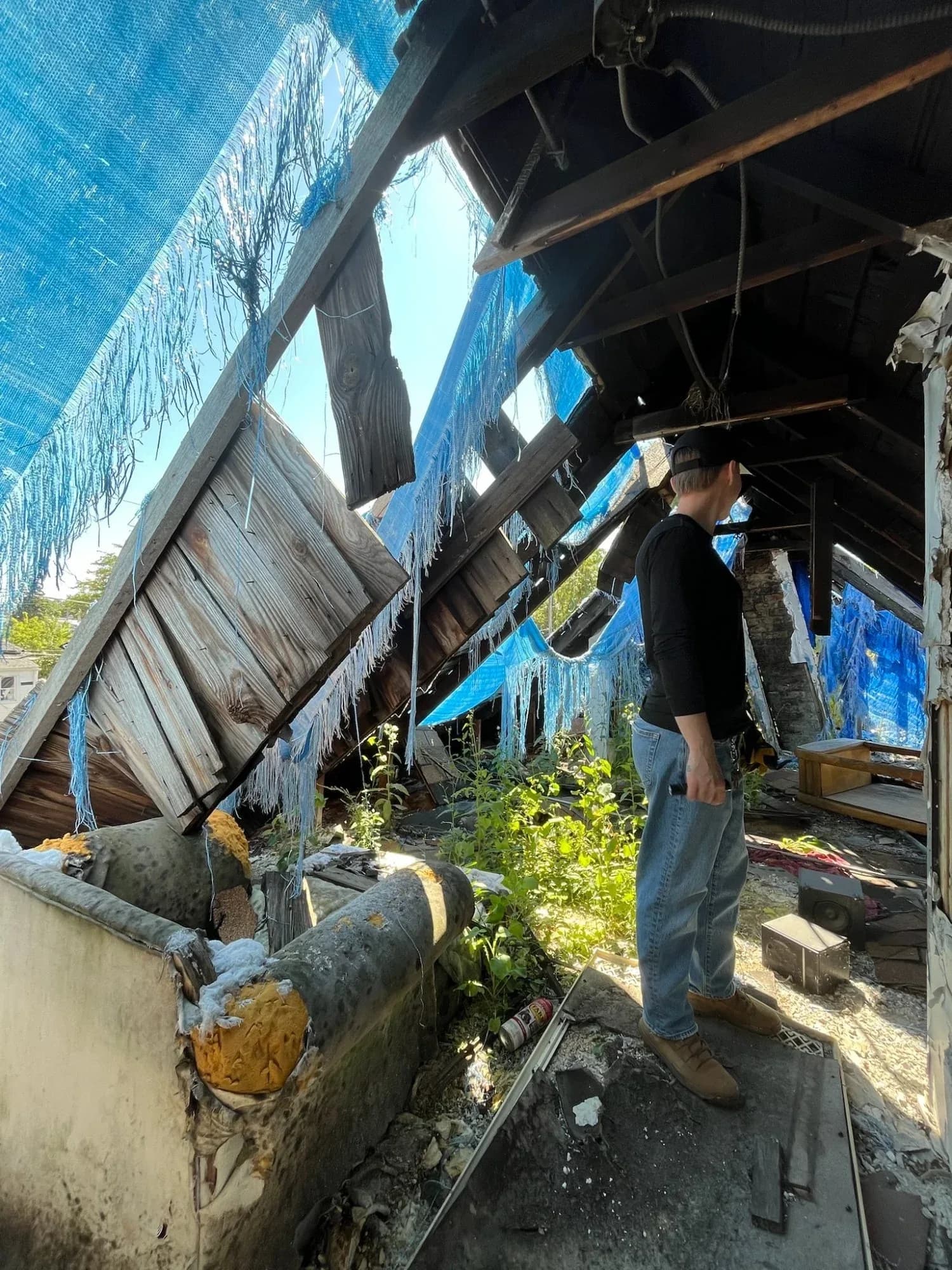 Dello Investments partner evaluating a damaged home in chicago
